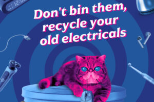 ‘HypnoCat’ (a magenta-coloured Persian cat with blue spiral eyes) sitting on a blue dustbin in front of a blue spiral background with electrical items floating in the spiral. Text: Humans, don't bin your old electricals. Recycle them.